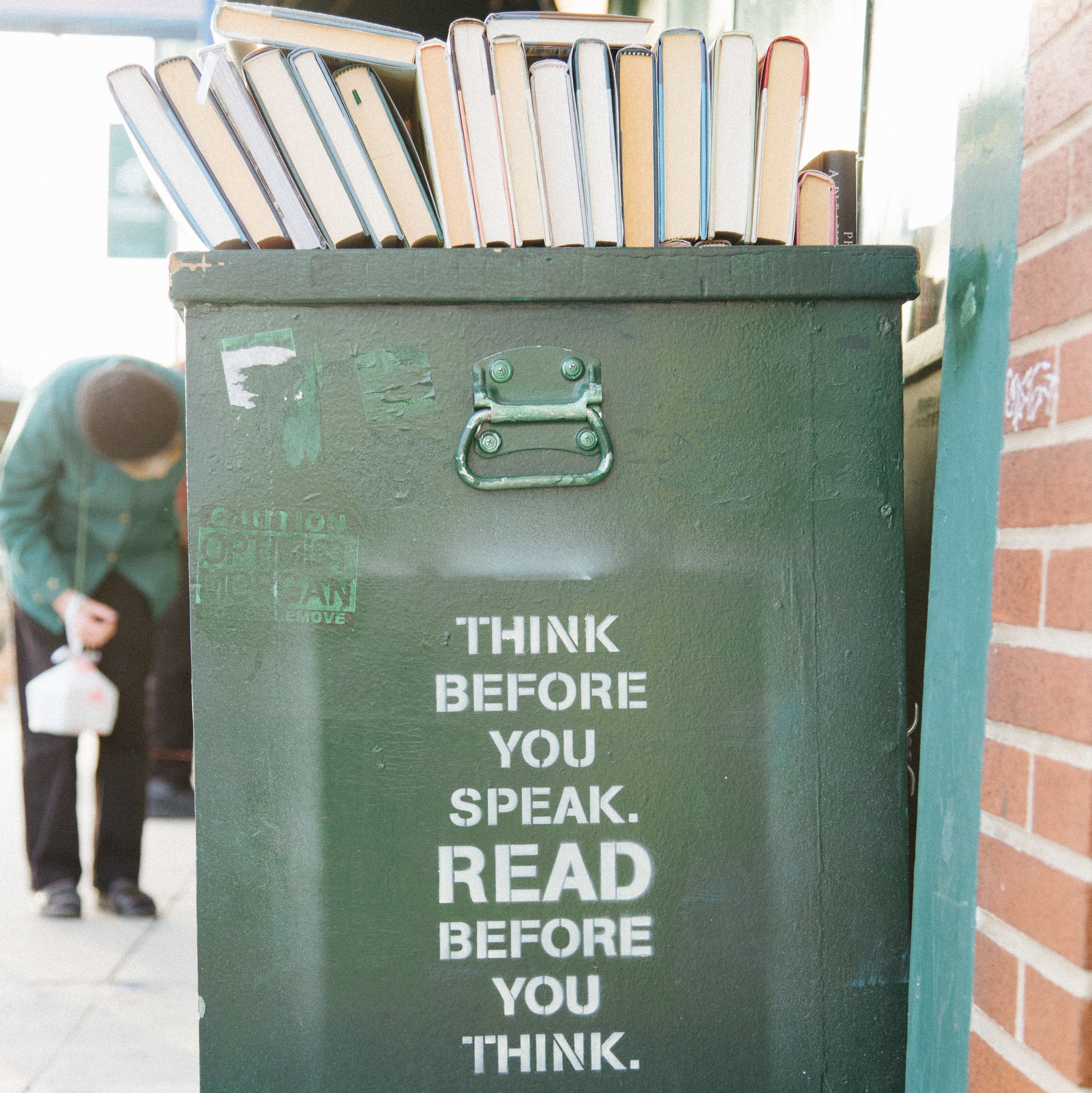 Bin with books and writing